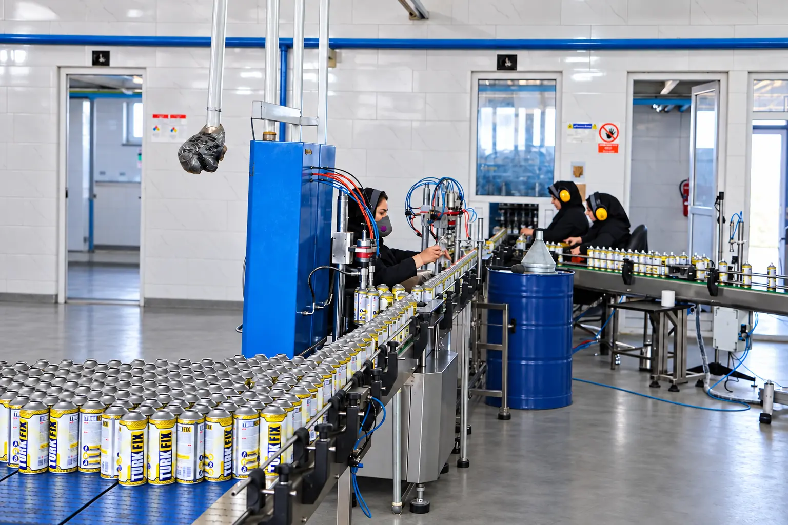 Macan Tejarat Barman team operating the TURK FIX aerosol production and filling line